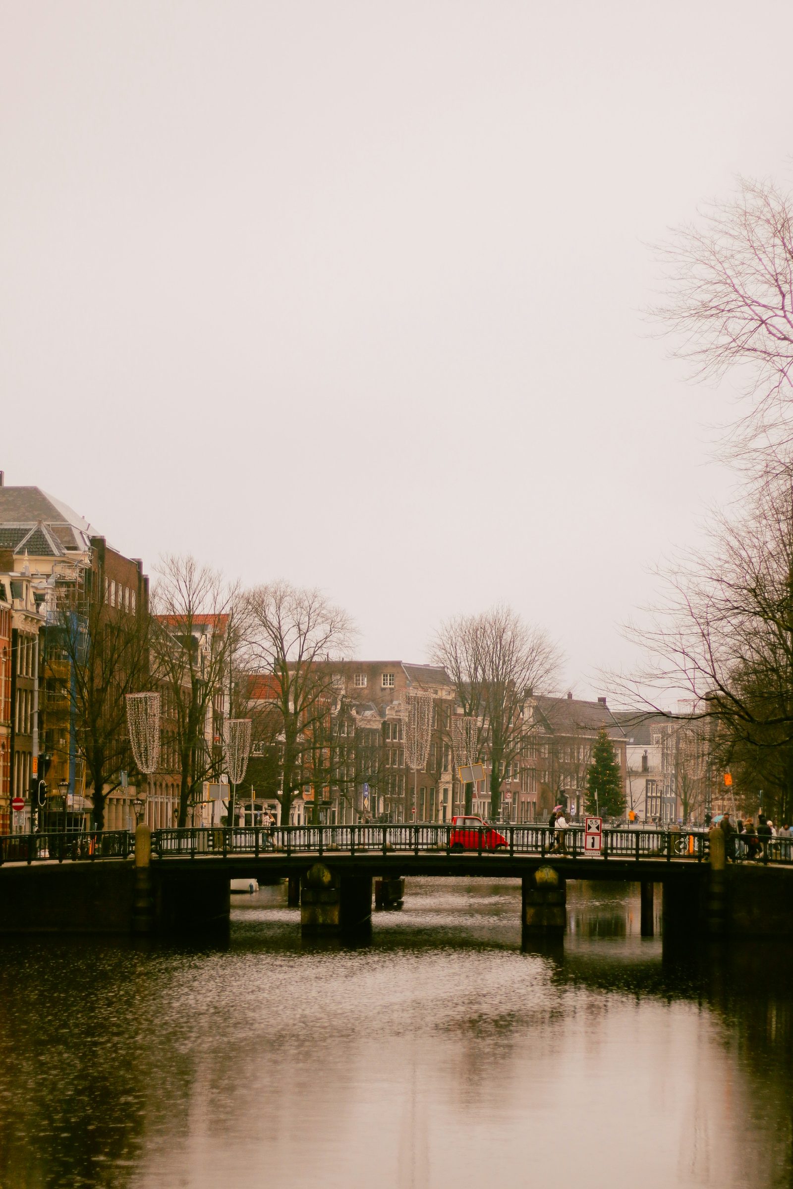 Amsterdam canal with bikes and gabled houses