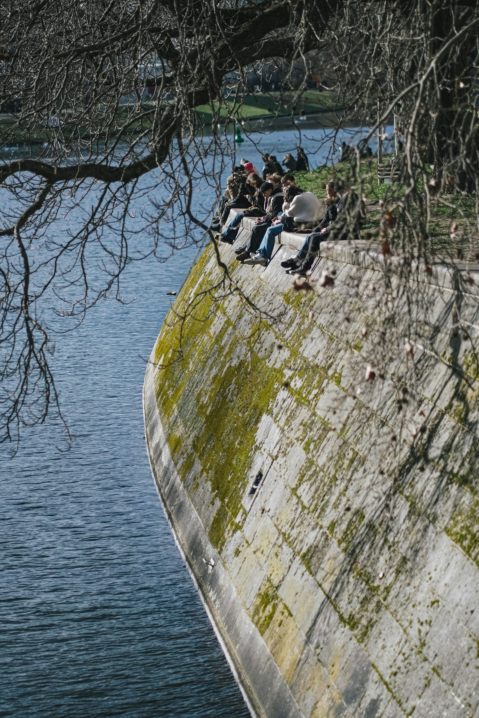 People sitting on the wall along the Landwehrkanal, Kreuzberg