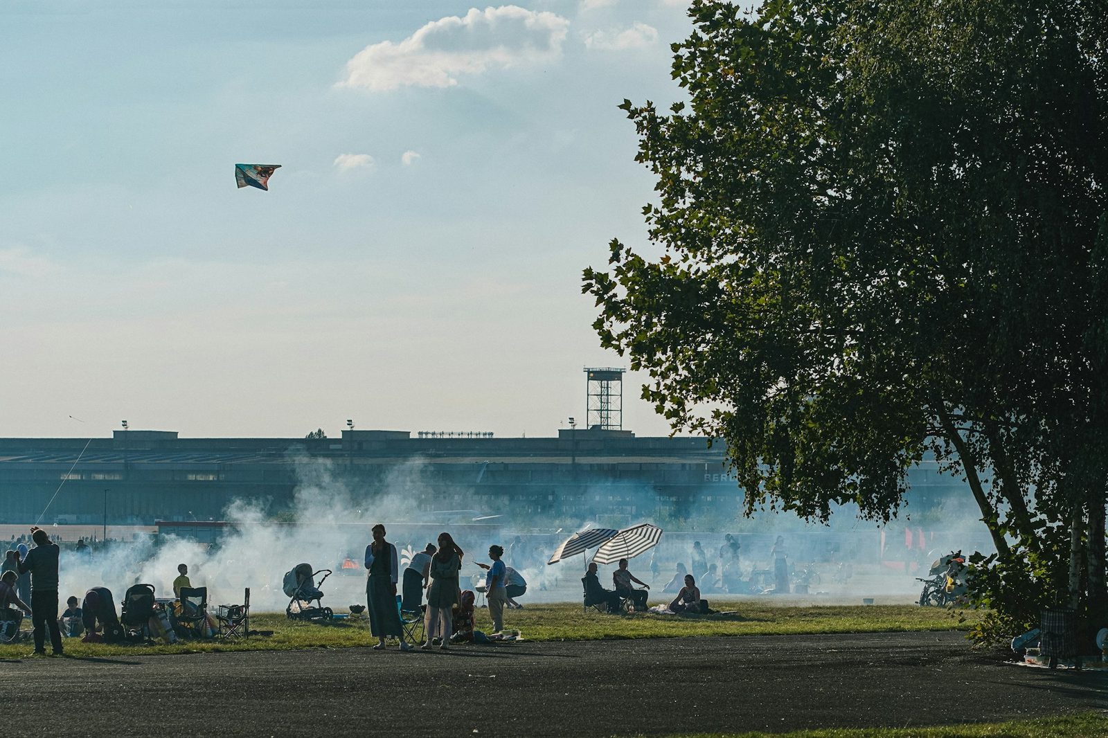 People gathered on the grass at Tempelhofer Feld