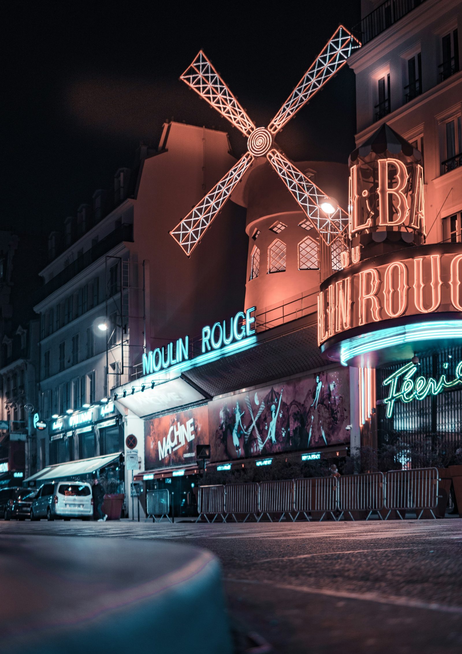 The Moulin Rouge windmill lit up at night